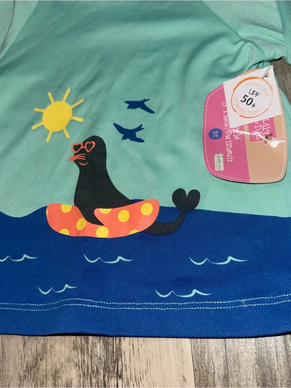 Mint Green Kids Long-Sleeve Rash Guard with Seal Float Graphic